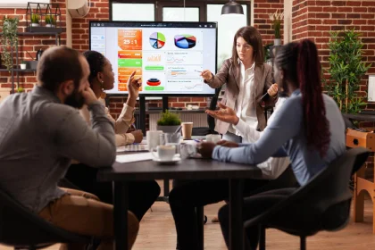Digital marketing team reviewing campaign performance and ROI